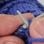Carson Demers, showing the English style of knitting setup