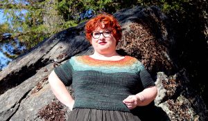 Kim McBrien-Evans wearing a bright coloured sweater