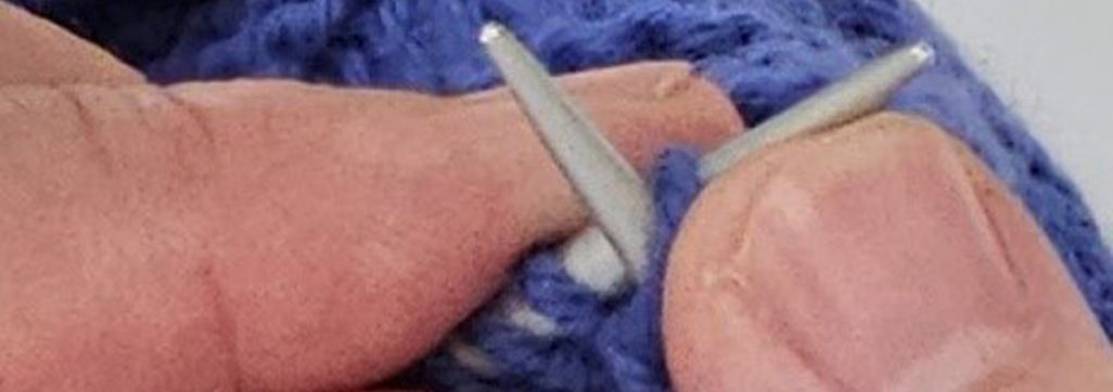 Carson Demers, showing the English style of knitting setup