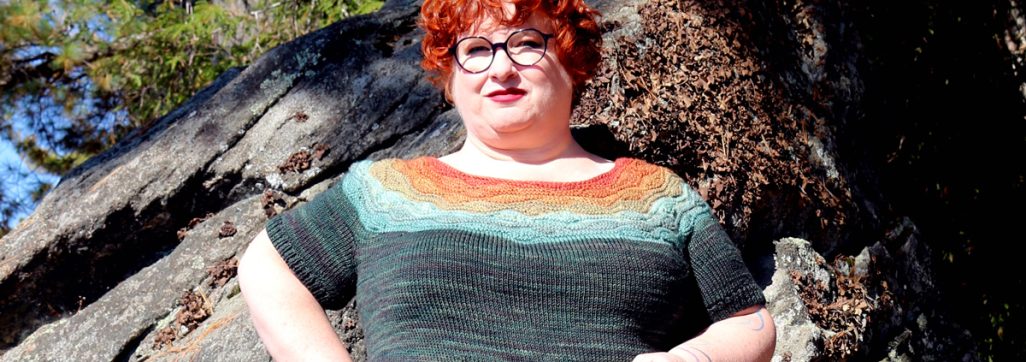Kim McBrien-Evans wearing a bright coloured sweater